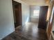 Bright and airy entryway with wood flooring and access to other rooms at 306 E Cherry St, Advance, IN 46102