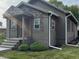 Charming house with gray siding, stone accents, and a welcoming front porch at 306 E Cherry St, Advance, IN 46102