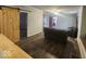 Living room with dark brown sectional sofa and barn door at 306 E Cherry St, Advance, IN 46102