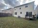 Spacious backyard with a deck and a view of neighboring houses at 3518 Birchfield Pl, Indianapolis, IN 46268