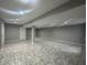 Finished basement with tile flooring and neutral walls at 3518 Birchfield Pl, Indianapolis, IN 46268