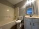 Clean bathroom with tub, toilet and vanity with sink at 3518 Birchfield Pl, Indianapolis, IN 46268