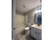 Basement bathroom with tub, toilet and vanity at 3518 Birchfield Pl, Indianapolis, IN 46268