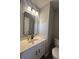 Updated bathroom with white vanity, black matte fixtures, and a large mirror at 3518 Birchfield Pl, Indianapolis, IN 46268