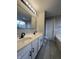 Main bathroom with double vanity, black faucets, and tile floor at 3518 Birchfield Pl, Indianapolis, IN 46268
