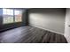 Spacious bedroom with large window and wood-like flooring at 3518 Birchfield Pl, Indianapolis, IN 46268
