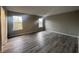 Spacious bedroom with gray walls and wood-look flooring at 3518 Birchfield Pl, Indianapolis, IN 46268