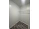Walk-in closet with wire shelving and laminate flooring at 3518 Birchfield Pl, Indianapolis, IN 46268