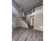 Bright entryway with hardwood floors and a staircase at 3518 Birchfield Pl, Indianapolis, IN 46268