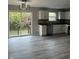 Modern kitchen with access to backyard and updated flooring at 3518 Birchfield Pl, Indianapolis, IN 46268