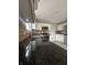 Kitchen boasts dark granite countertops and white cabinets at 3518 Birchfield Pl, Indianapolis, IN 46268