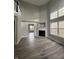 Spacious living room with gray walls, fireplace, and hardwood floors at 3518 Birchfield Pl, Indianapolis, IN 46268