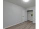 Spacious bedroom with grey vinyl flooring and neutral walls at 3745 N Kercheval Dr, Indianapolis, IN 46226