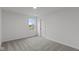 Bright bedroom with gray carpeting and a window at 4973 Amber Crest Dr, Brownsburg, IN 46112