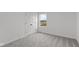 Spacious bedroom with gray carpet and a window at 4973 Amber Crest Dr, Brownsburg, IN 46112