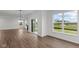 Bright dining area with hardwood floors and large windows at 4973 Amber Crest Dr, Brownsburg, IN 46112