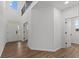 Two-story entryway with hardwood floors and access to other rooms at 4973 Amber Crest Dr, Brownsburg, IN 46112