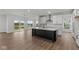 Modern kitchen with white cabinets, granite countertops, and a large island at 4973 Amber Crest Dr, Brownsburg, IN 46112