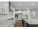 Modern kitchen with white cabinets, granite countertops, and a large island at 4973 Amber Crest Dr, Brownsburg, IN 46112