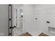 Laundry room with shelving and a drain in the floor at 4973 Amber Crest Dr, Brownsburg, IN 46112