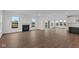 Open living room featuring hardwood floors and a fireplace at 4973 Amber Crest Dr, Brownsburg, IN 46112