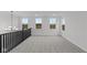Bright loft with gray carpeting and multiple windows at 4973 Amber Crest Dr, Brownsburg, IN 46112