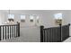Spacious loft area with gray carpeting and multiple windows at 4973 Amber Crest Dr, Brownsburg, IN 46112