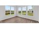 Bright sunroom with multiple windows and hardwood floors at 4973 Amber Crest Dr, Brownsburg, IN 46112