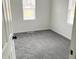Bright bedroom with gray carpet and neutral walls at 6902 Rodebaugh Rd, Indianapolis, IN 46268