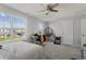 Bedroom with a hanging chair, desk, and large windows at 10797 Walden Ln, Brownsburg, IN 46112