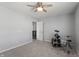 Bedroom with a drum kit, ceiling fan, and neutral wall color at 10797 Walden Ln, Brownsburg, IN 46112
