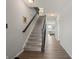 Bright and spacious entryway with hardwood floors and a staircase leading upstairs at 10797 Walden Ln, Brownsburg, IN 46112