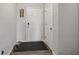 Simple foyer with white door and coat closet at 10797 Walden Ln, Brownsburg, IN 46112
