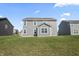 Gray two story house with a patio and yard at 10797 Walden Ln, Brownsburg, IN 46112