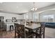 Kitchen with an island, hardwood floors, and a dining table at 10797 Walden Ln, Brownsburg, IN 46112