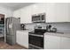 Modern kitchen with stainless steel appliances and ample counter space at 10797 Walden Ln, Brownsburg, IN 46112