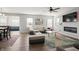 Spacious living room with sectional sofa, fireplace, and large TV at 10797 Walden Ln, Brownsburg, IN 46112