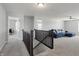 Spacious loft area with a sectional sofa and access to other rooms at 10797 Walden Ln, Brownsburg, IN 46112