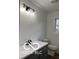 Bathroom with gray vanity and updated lighting at 11 S 1050 W, Jamestown, IN 46147