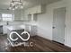 Modern kitchen with white cabinets and an island at 11 S 1050 W, Jamestown, IN 46147