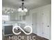 Modern kitchen features white cabinets, gray island, and updated lighting at 11 S 1050 W, Jamestown, IN 46147
