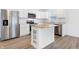 Modern kitchen with stainless steel appliances and kitchen island at 1482 Coen Ct, Columbus, IN 47201