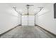 Spacious garage with concrete flooring and automatic opener at 1492 Coen Ct, Columbus, IN 47201