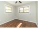 Bright bedroom featuring hardwood floors and multiple windows at 408 N Sherwood Dr, Muncie, IN 47304