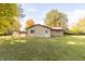 Ranch home with a spacious backyard and storage shed at 408 N Sherwood Dr, Muncie, IN 47304