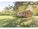 Ranch home with a spacious backyard and storage shed at 408 N Sherwood Dr, Muncie, IN 47304