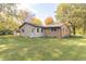 Ranch home with a spacious backyard and storage shed at 408 N Sherwood Dr, Muncie, IN 47304
