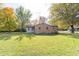 Ranch home with a spacious backyard and storage shed at 408 N Sherwood Dr, Muncie, IN 47304