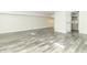 Finished basement with grey plank flooring and an ensuite bathroom at 408 N Sherwood Dr, Muncie, IN 47304