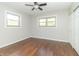 Spacious bedroom featuring hardwood floors and two large windows at 408 N Sherwood Dr, Muncie, IN 47304